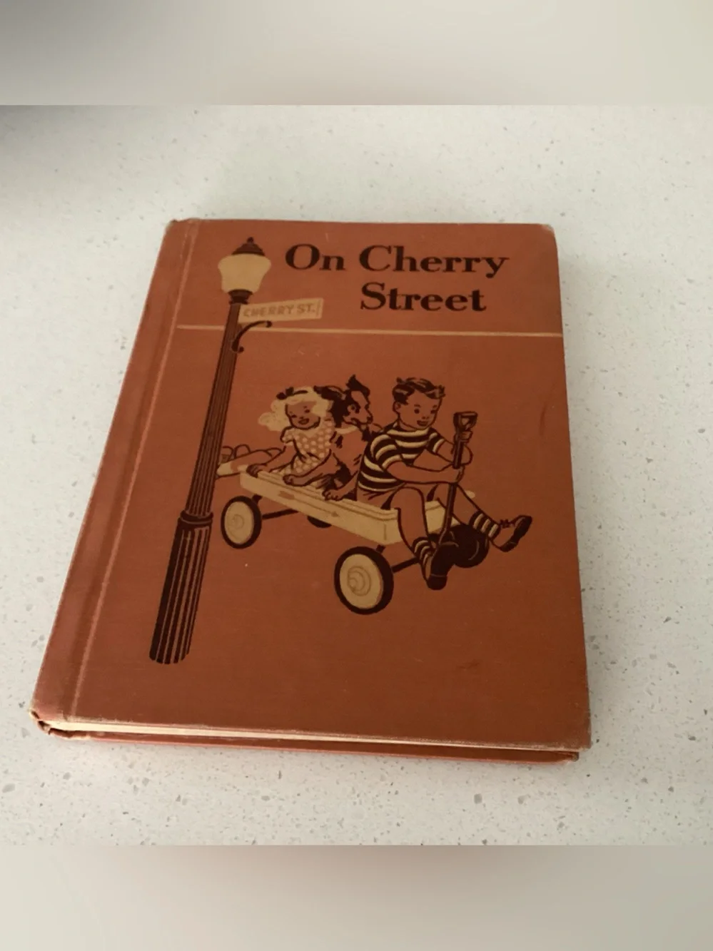 Vtg. Children’s book titled On Cherry Street, a school textbook first published